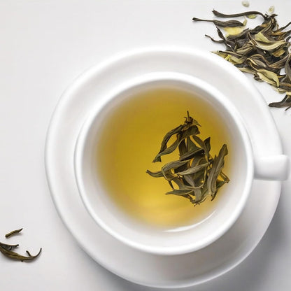 Brewed Darjeeling Lemongrass Black Tea showing golden amber colour.