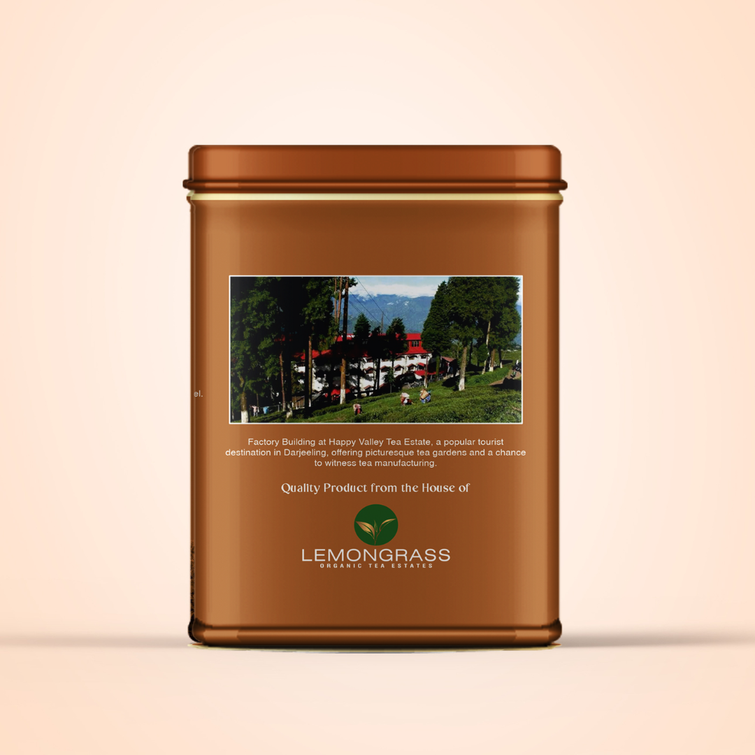 Vintage Darjeeling tea tin featuring estate landscape on label